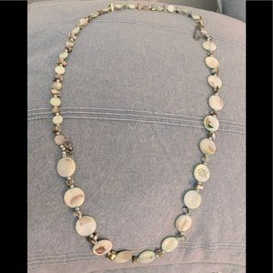 Light green stone and bead necklace .